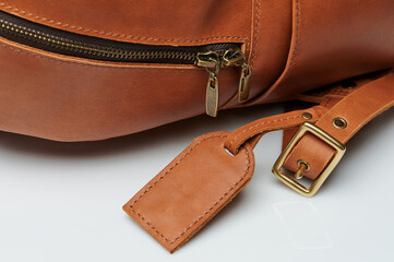 Accessories on brown leather backpack