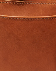 Fototapeta premium Brown leather background with stitches