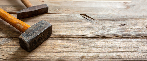 Hammer vintage on wood. Sledgehammer old with wooden grip on table