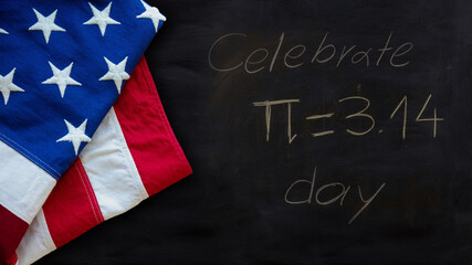 Pi number day, Celebrate Pi text chalk drawing and US flag on a school black board.
