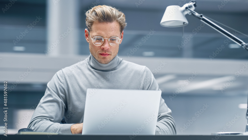 Aufkleber modern office: businessman sitting at his desk working on a laptop computer. digital entrepreneur wo
