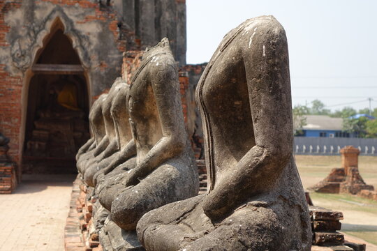 Line of headless statues at Wat Chai Watthanaram temple, Ayutthaya, Thailand (horizontal image)