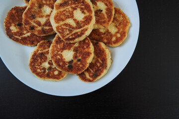 homemade cheesecakes on a plate. view from above. traditional russian food