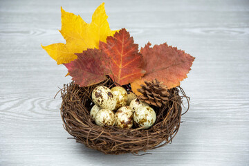 Easter basket with Easter eggs on a wooden background. Spring composition. Postcard Happy Easter.