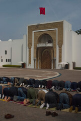 People praying at prayer time in front of the Palais Royal in Plaze El Mechuar in Tetouam, Morocco