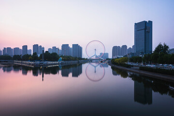 Night scene cityscape of Tianjin ferris wheel,Tianjin eyes in twilight time.Most Modern and popular landmark in Tianjin city.