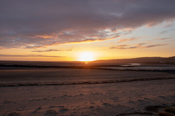 Fototapeta na wymiar Sunset along Llanelli beach in Wales.