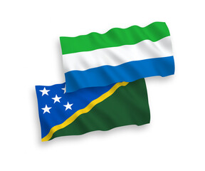 Flags of Solomon Islands and Sierra Leone on a white background