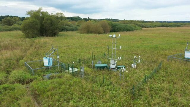 Station science research for studying wetlands meadows, drone aerial video shot ecosystem weather station swamp willows cycle carbon flux eddy covariance methane research physiological photosynthesis