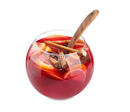 Glass bowl of delicious aromatic punch drink and wooden ladle isolated on white