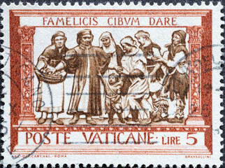 Vatican City - circa 1960: a postage stamp from Vatican City , showing a depiction of “Feeding...