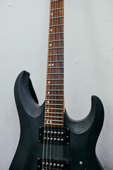 Fototapeta na wymiar Black electric guitar and strings close up.