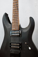 Fototapeta na wymiar Black electric guitar and strings close up.