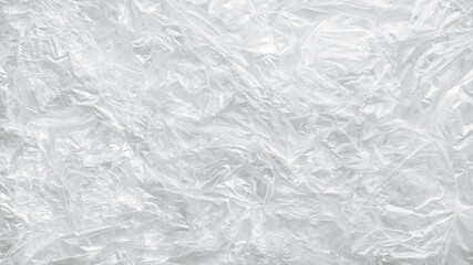 Background with the image of a plastic bag, the texture of a crumpled transparent bag, the concept of plastic pollution