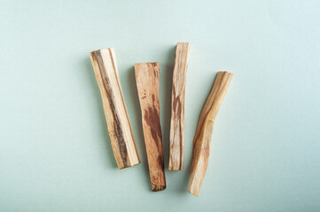 Palo Santo bars close-up and copy space. Ritual cleansing with sacred ibiocai, meditation, aromatherapy with incense and candles..