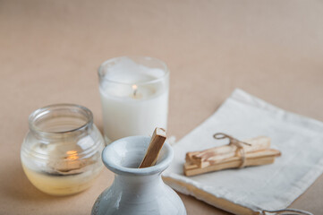 Palo Santo bars close-up and copy space. Ritual cleansing with sacred ibiocai, meditation, aromatherapy with incense and candles..