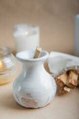 Palo Santo bars close-up and copy space. Ritual cleansing with sacred ibiocai, meditation, aromatherapy with incense and candles..
