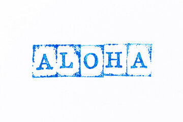 Blue color ink rubber stamp in word aloha on white paper background - obrazy, fototapety, plakaty