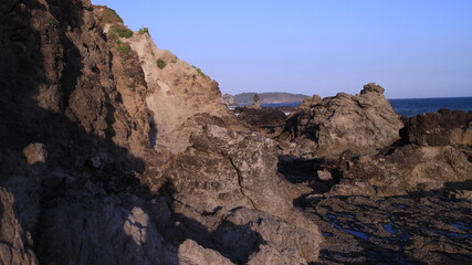 Fototapeta na wymiar The edge of the Cliff Beach which is dominated by coral rocks that are gripping but still amazing