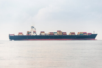A cargo ship delivers a lot of containers with goods from China. Sea shipment and transportation...