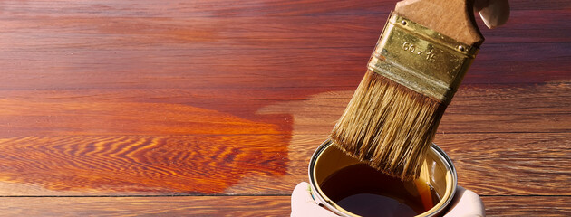 Painted wooden board with transparent protective water-based finish. House renovation works.