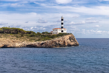 Fototapeta na wymiar Lighthouse of Portocolom or Porto Colom, Majorca, Mallorca, Balearic Islands, Spain