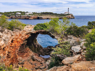Natural arch opposite to the lighthouse of Portocolom or Porto Colom, Majorca, Mallorca, Balearic...