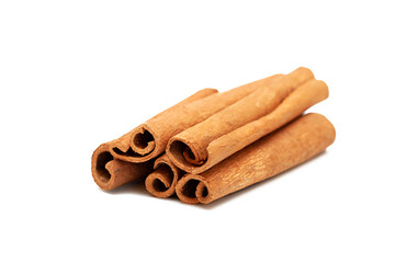 Close up of cinnamon sticks on white background