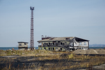 Fototapeta na wymiar Old abandoned sea port in Aleksandrovsk-Sakhalinsky