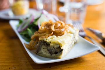 Traditional french pie with bacon and cheese - quiche lorraine, with vegetables