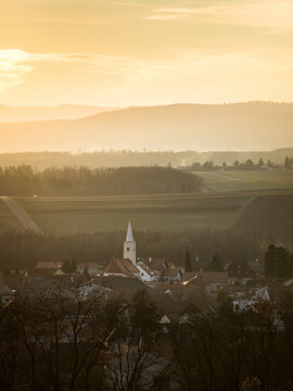  Sunset behind the Village of Ritzing Burgenland with the orange sky