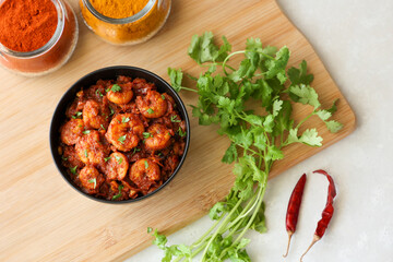 Top view spicy hot Prawn roast shrimp fry masala fish curry. Indian food fish fry red fish curry...