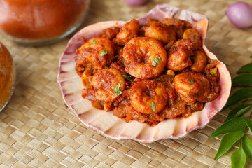 spicy hot Prawn roast shrimp fry masala fish curry in sea shell Indian food fish fry red fish curry Asian cuisine Kerala fish curry South Indian Bengali Goan fish curry Grilled tiger shrimps Sri Lanka