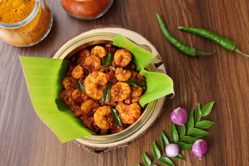 Top view spicy hot Prawn roast shrimp fry masala fish curry. Indian food fish fry red fish curry Asian cuisine Kerala fish curry South Indian Bengali  Goan fish curry Grilled tiger shrimps Sri Lanka
