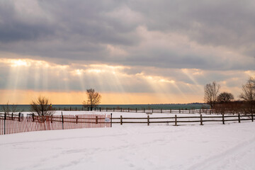 Dramatic clouds over an offleash dog park on the shore of  Lake Ontario..  Suitable for background, space for text.