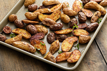 Roasted crispy fingerling potatoes on a sheet pan