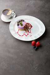 Fresh blueberry cake decorated served with cup of tea