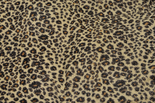 Leopard pattern background with fabric texture