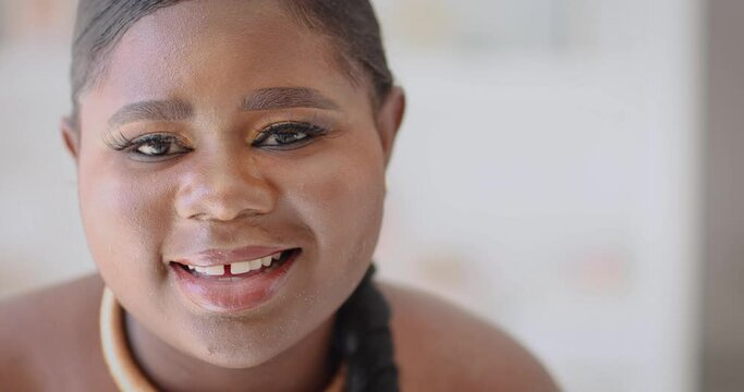 head portrait of smiling young woman with cute gapped tooth smile