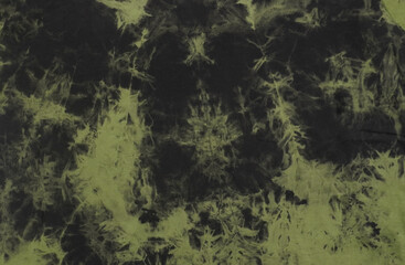 abstract motif from tie-dye fabric in green and black