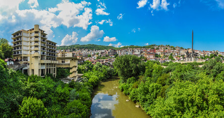 Fototapeta na wymiar Veliko Tarnovo Bulgaria panorama - the river passes through the city - blue sky