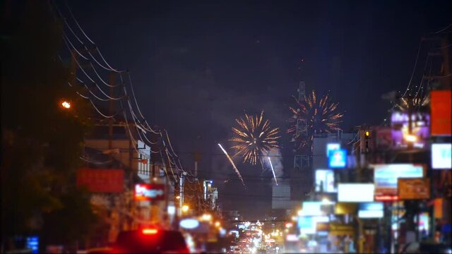 The majestic beauty and colorful lights of fireworks lit up at night with a city backdrop, Pattaya fireworks Festival