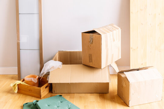 Boxes with belongings in new apartment