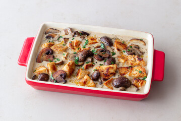 Baked chicken and mushrooms in a creamy sauce. French cuisine. Fricassee.