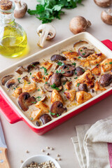 Baked chicken and mushrooms in a creamy sauce. French cuisine. Fricassee.