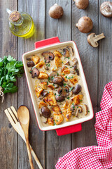 Baked chicken and mushrooms in a creamy sauce. French cuisine. Fricassee.
