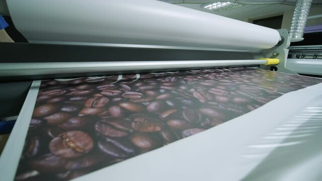 Laminating machine. Banner lamination. Polygraphy