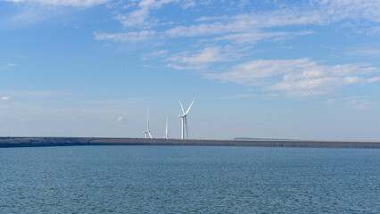 Fototapeta na wymiar background of wind turbines , clean energy concept