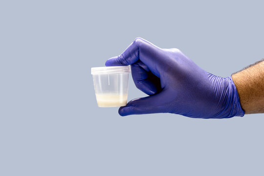hand using Nitrile glove for male semen or sperm collection, semen donation concept