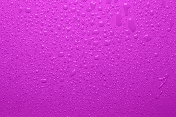 Water drops on pink color  surface